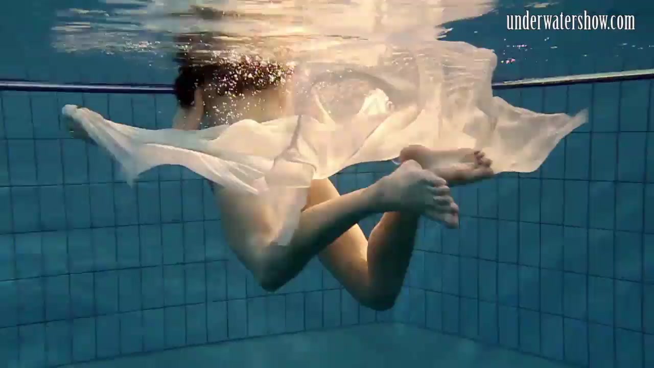 Dark Haired Teen Plays with Big Tits